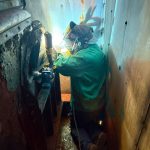 QMS field weld on bearing supports inside tight access equipment.