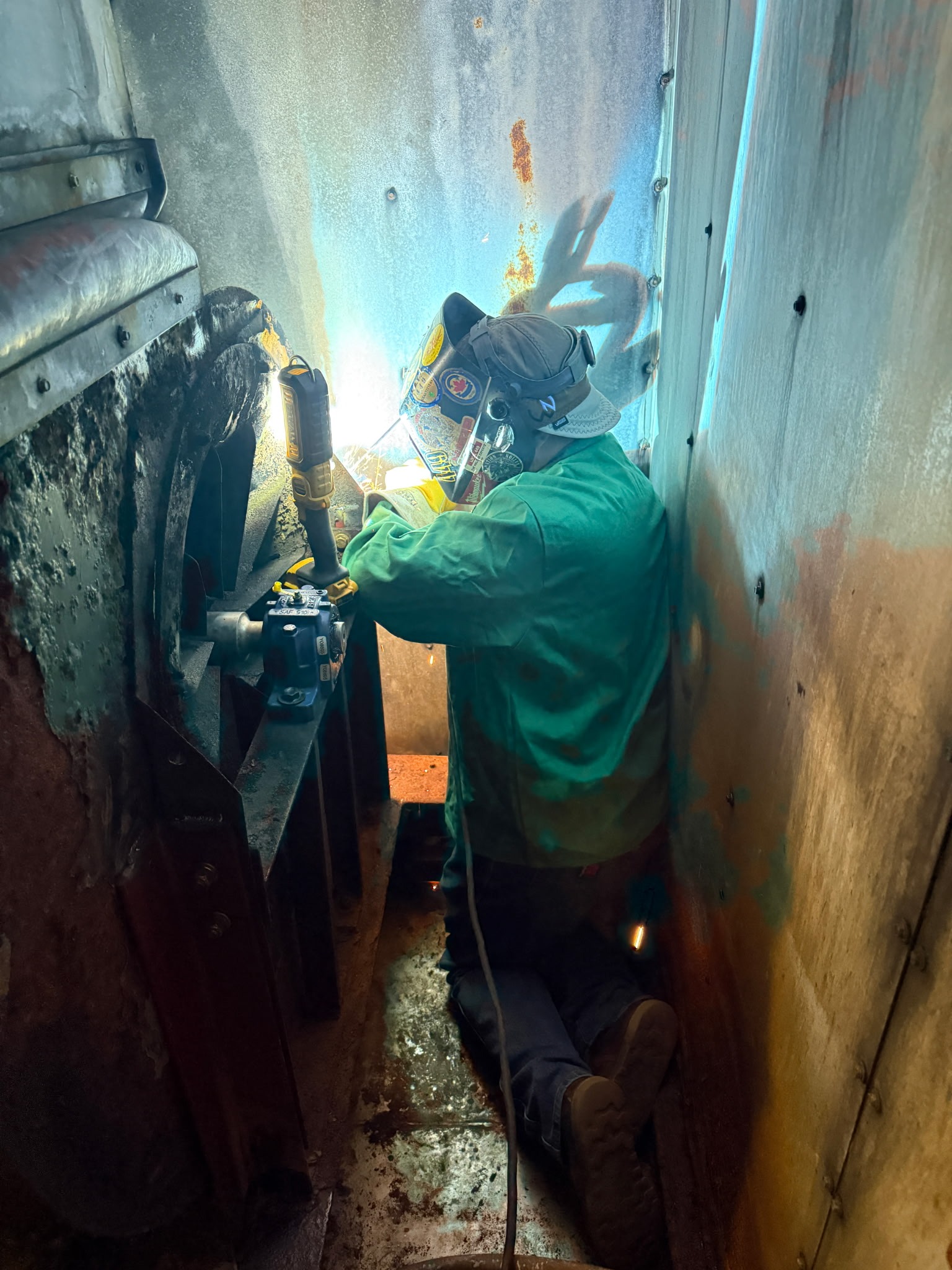 QMS field weld on bearing supports inside tight access equipment.